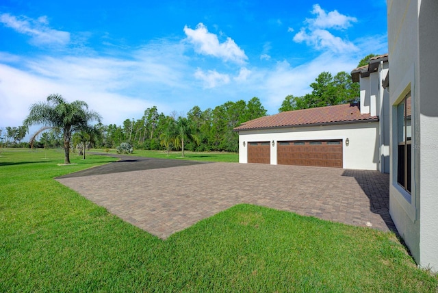 view of yard featuring a garage