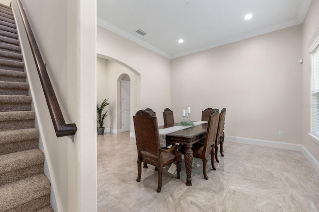 tiled dining space with ornamental molding