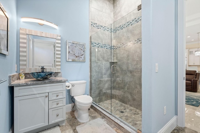 bathroom with vanity, an enclosed shower, tile patterned flooring, and toilet