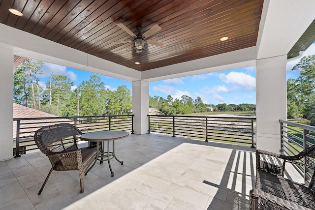 view of patio / terrace featuring a balcony and ceiling fan