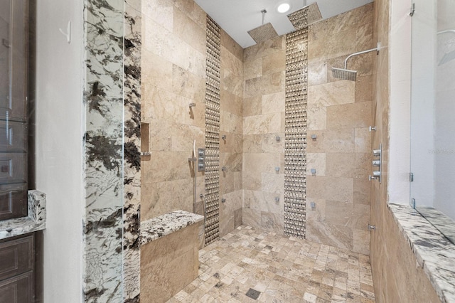 bathroom with a tile shower