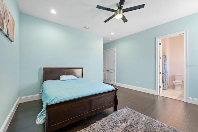 bedroom featuring ensuite bathroom, ceiling fan, and dark hardwood / wood-style flooring