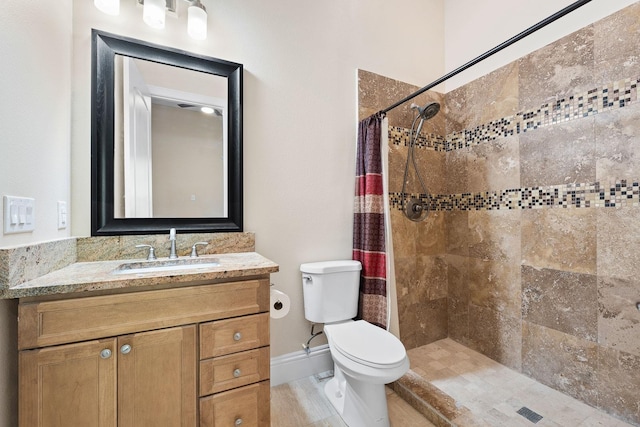 bathroom featuring curtained shower, tile patterned floors, toilet, and vanity