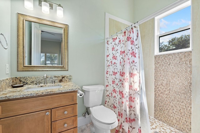 bathroom featuring tile patterned floors, toilet, and vanity