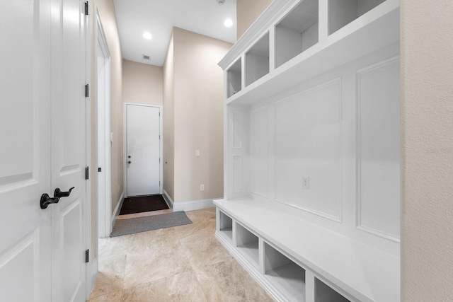 mudroom with light tile patterned flooring