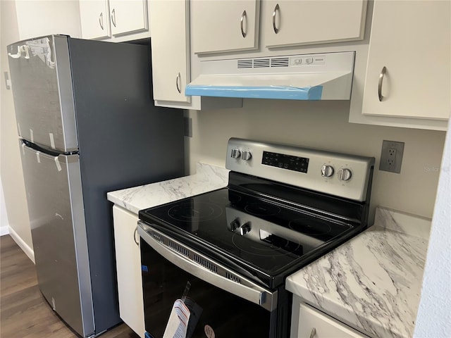 kitchen with stainless steel appliances, white cabinetry, dark wood-type flooring, and range hood