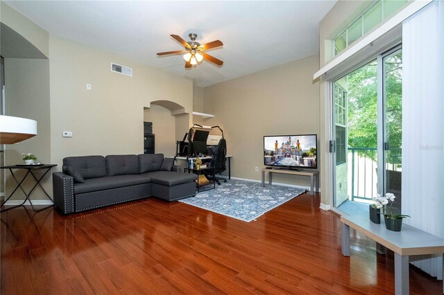 living room featuring ceiling fan and hardwood / wood-style flooring