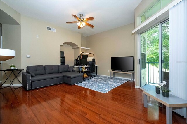 living room with ceiling fan and hardwood / wood-style flooring