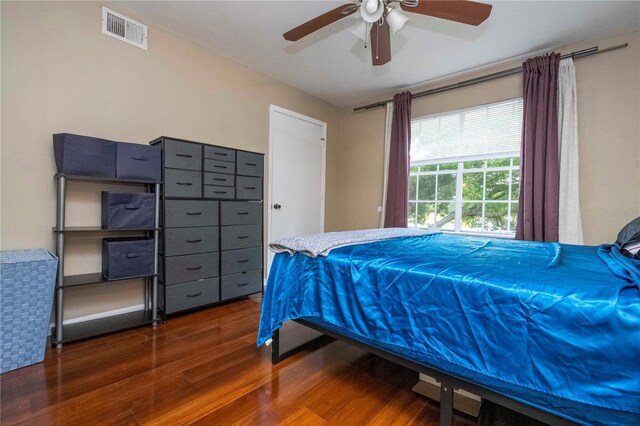 bedroom featuring hardwood / wood-style flooring and ceiling fan