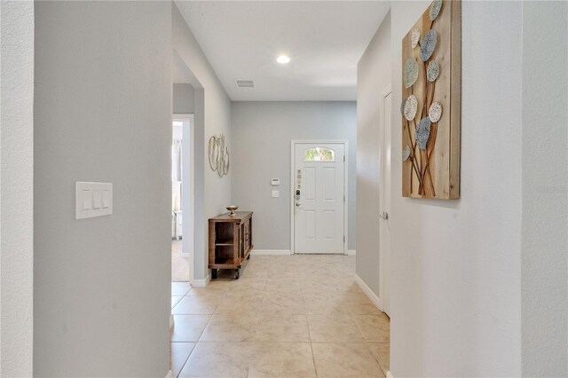 corridor with light tile floors