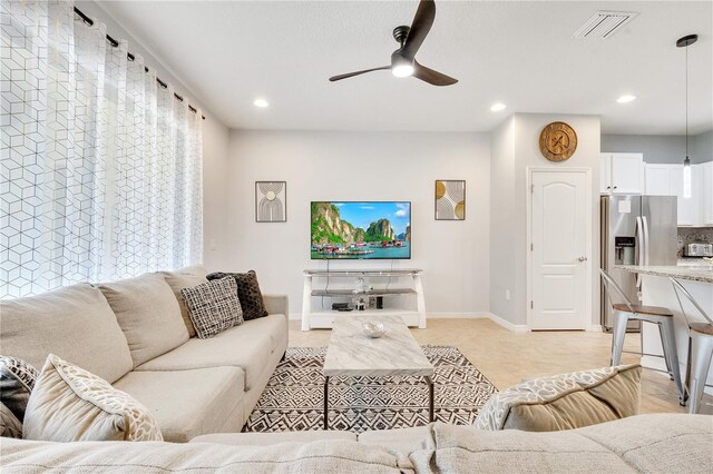 living room featuring ceiling fan