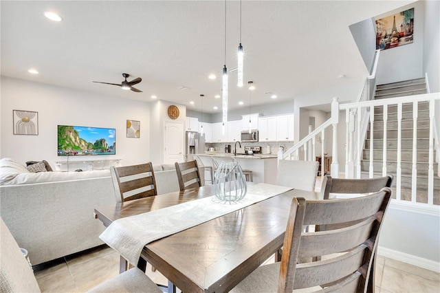 dining room with light tile patterned floors, recessed lighting, ceiling fan, baseboards, and stairs