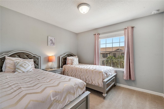 carpeted bedroom with a textured ceiling