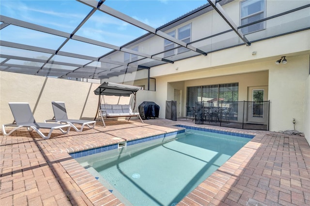 view of pool featuring a patio and a lanai