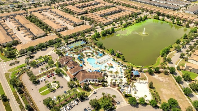 birds eye view of property with a residential view and a water view