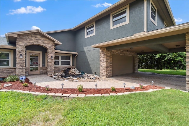 view of front of house with a front lawn and a carport