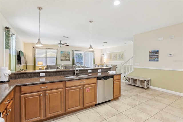 kitchen featuring stainless steel dishwasher, ceiling fan, sink, and hanging light fixtures