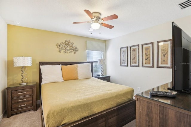 bedroom featuring ceiling fan and light colored carpet