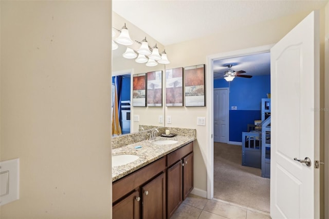 bathroom featuring ceiling fan, tile patterned flooring, and vanity