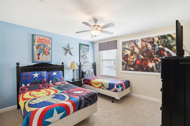 bedroom with ceiling fan and light colored carpet