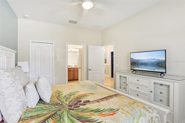 bedroom with ceiling fan, a closet, and ensuite bath