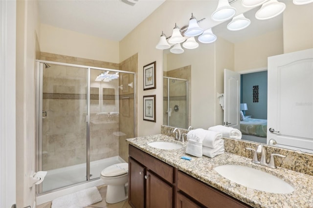 bathroom featuring vanity, toilet, tile patterned floors, and walk in shower