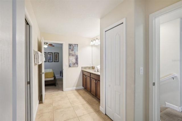 bathroom featuring ceiling fan, vanity, and tile patterned floors