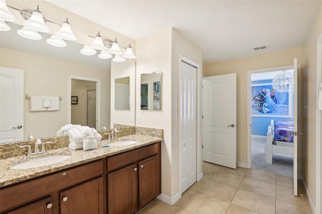 bathroom with vanity and tile patterned flooring