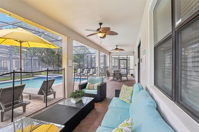 sunroom with ceiling fan