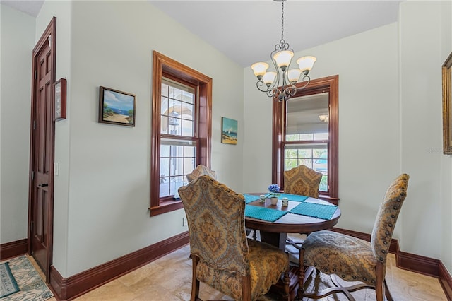 dining space with an inviting chandelier and a healthy amount of sunlight