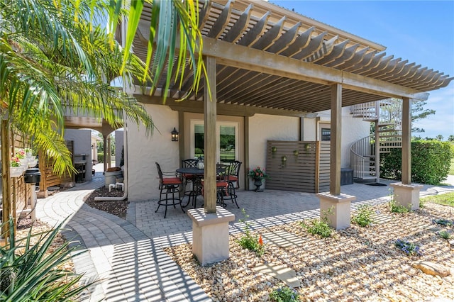 view of patio featuring a pergola