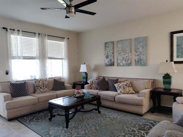 living room featuring ceiling fan and light tile patterned flooring