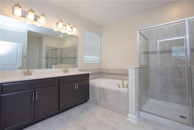 bathroom featuring tile patterned floors, vanity, and plus walk in shower