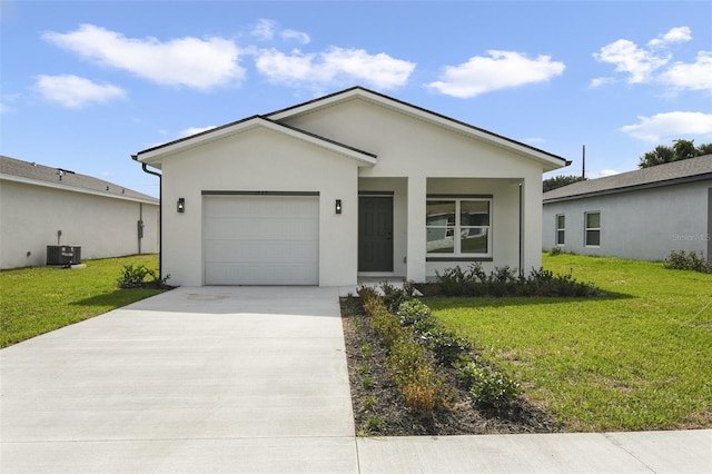 ranch-style home featuring a garage, central AC unit, and a front lawn