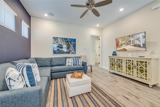 living room with ceiling fan and wood-type flooring