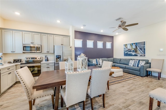 dining area featuring light hardwood / wood-style floors and ceiling fan