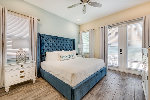 bedroom featuring ceiling fan, light hardwood / wood-style floors, access to exterior, and french doors