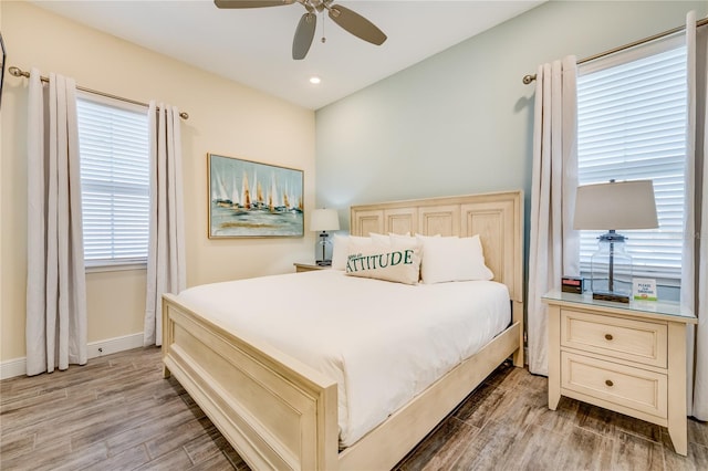 bedroom with ceiling fan and wood-type flooring