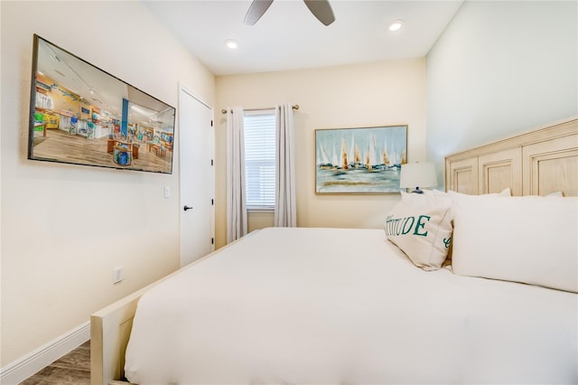 bedroom featuring ceiling fan and hardwood / wood-style flooring