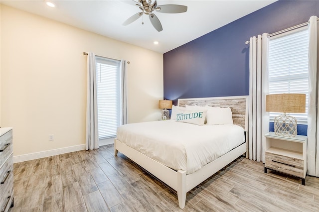 bedroom featuring light hardwood / wood-style flooring and ceiling fan