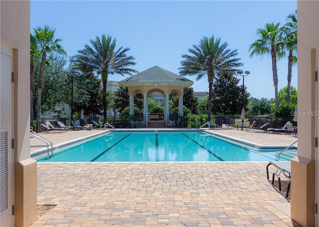 view of swimming pool with a patio area and a gazebo