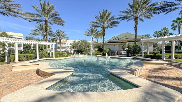 view of swimming pool with a pergola