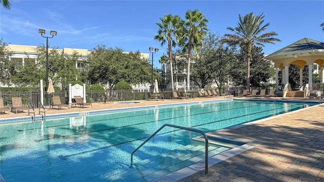 view of swimming pool featuring a patio area