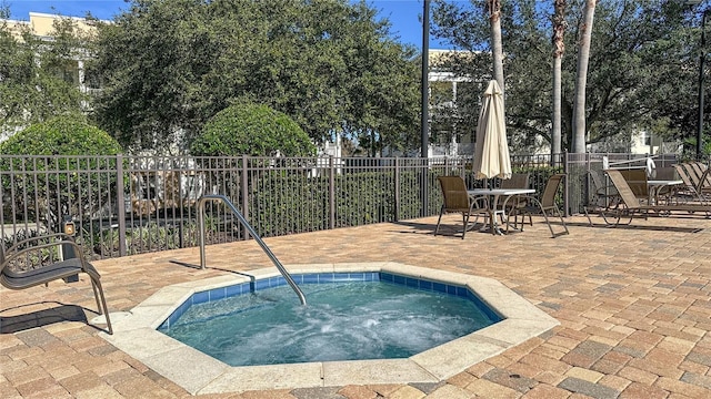 view of swimming pool featuring a patio and a community hot tub