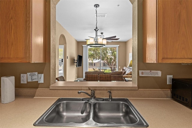 kitchen with sink and pendant lighting