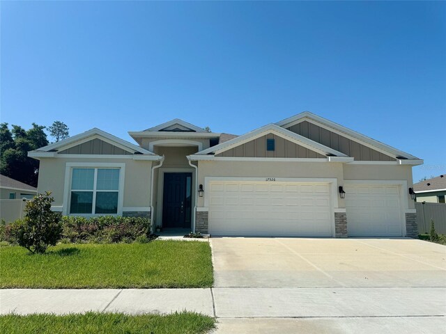 17926 Hither Hills Cir, Winter Garden, FL 34787 - view of front of home with a garage