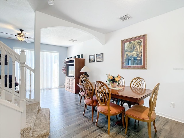 dining space featuring hardwood / wood-style flooring and ceiling fan