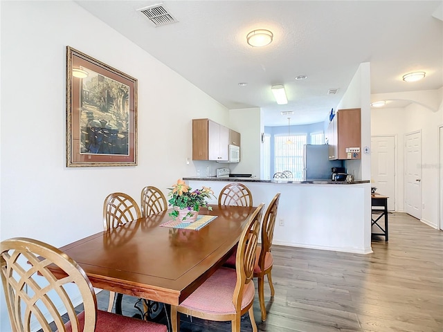 dining room featuring light hardwood / wood-style floors