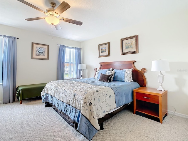 bedroom featuring light carpet and ceiling fan