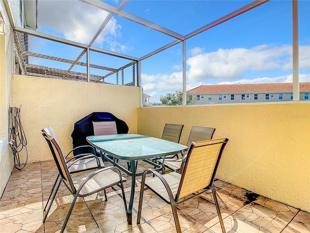 view of patio with glass enclosure